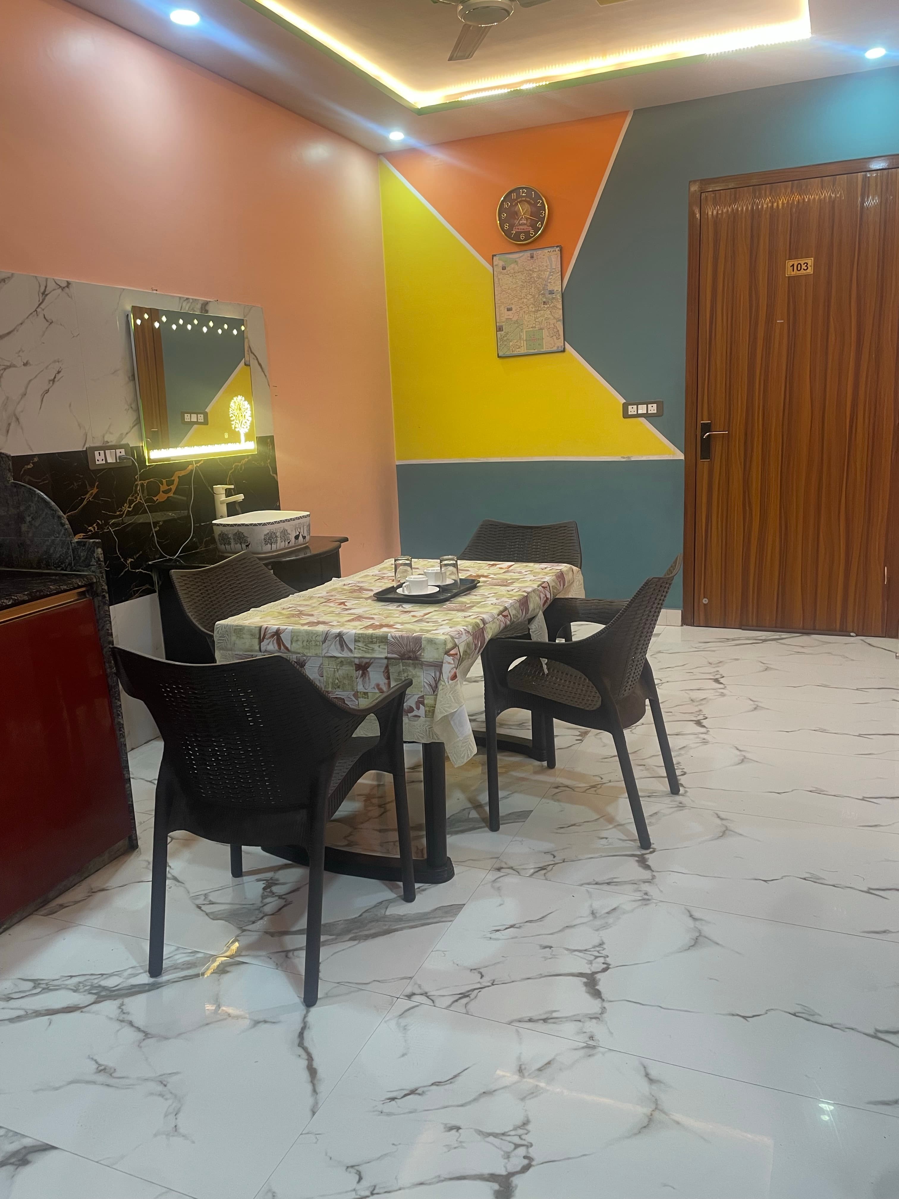 Dining area with colourful accent wall
