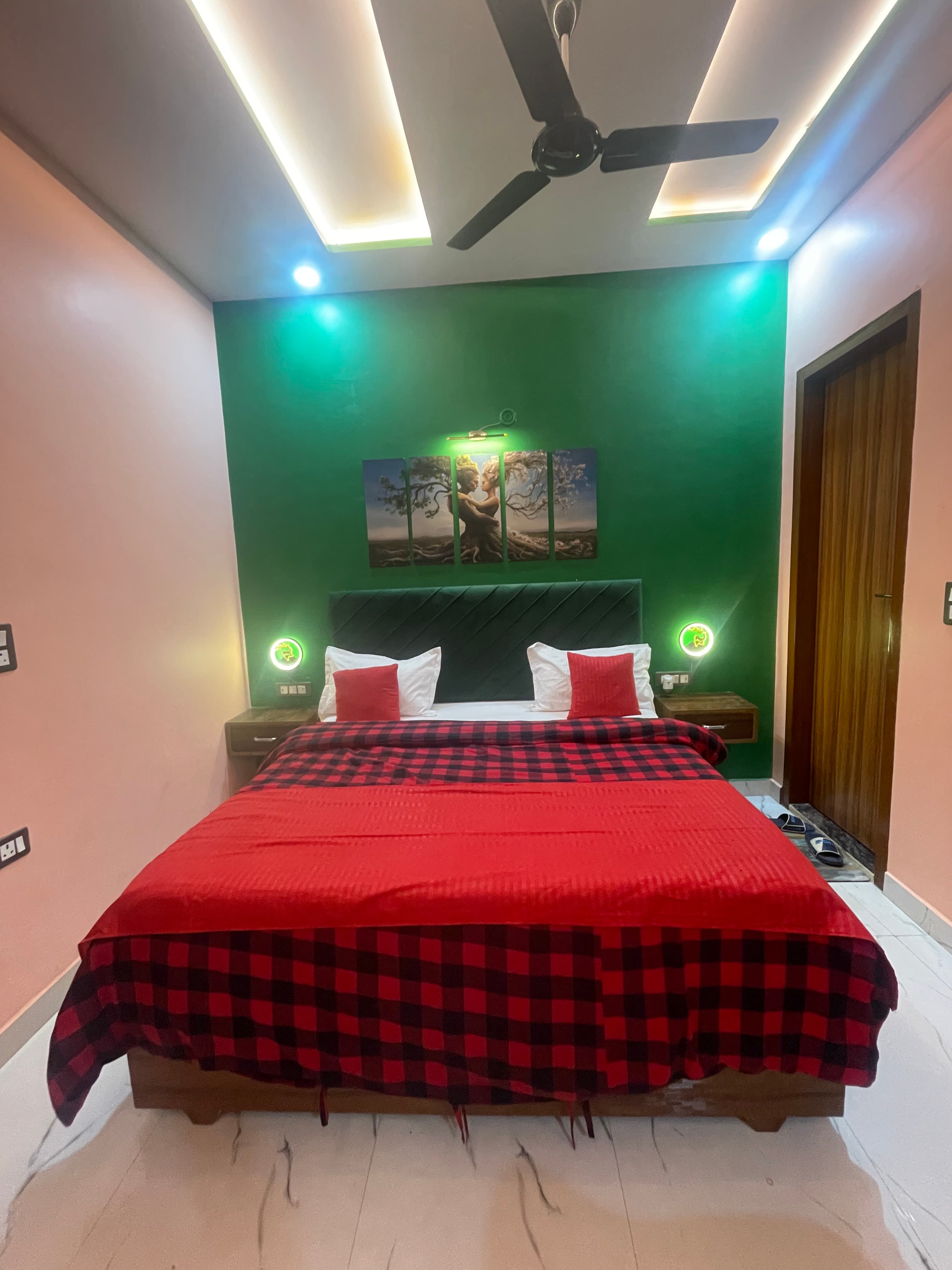 2BHK Private Flat bedroom at VMP Villa โ green accent wall with LED lighting
