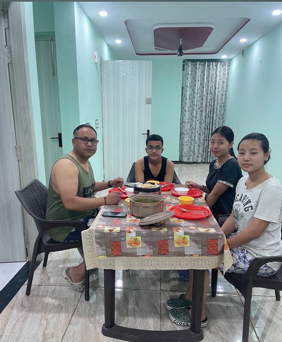 Happy guests enjoying a home-cooked meal at the VMP Villa dining table
